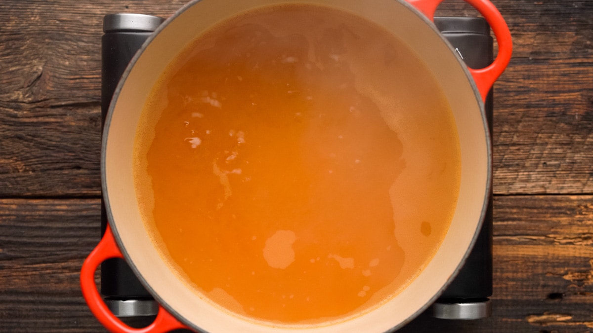 Water and broth cooking in a Dutch oven