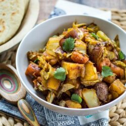 This easy vegan dish is one of my favorite parts of any Ethiopian meal! Humble Atakilt Wat is made from cabbage, carrots, and potatoes spiced with fragrant Berbere seasoning. Serve it with simmered lentils and Ethiopian flatbread for an easy weeknight dinner!