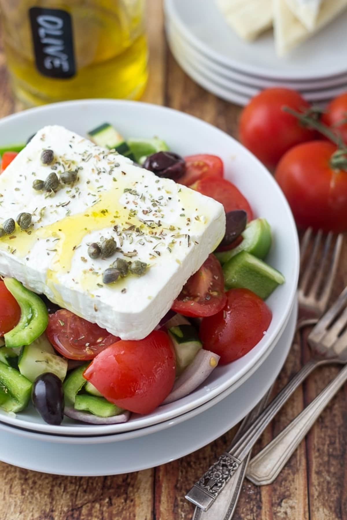 A Classic Greek Salad in a white bowl.