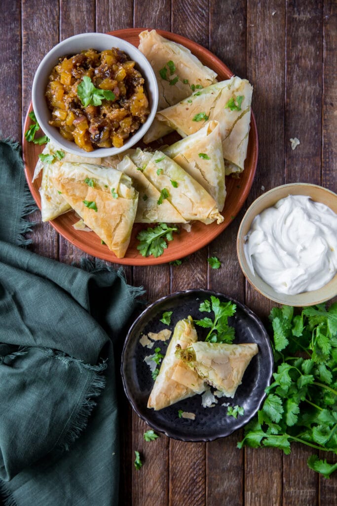 This Baked Samosa Beef recipe is a delicious combination of lean beef, potatoes, peas, sweet yellow onions and spices wrapped up in a golden pastry shell for a savory, crunchy appetizer.