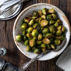 This Balsamic Brussel Sprouts recipe is easy to make by oven roasting Brussel sprouts until they are crispy and then coating them with a glaze of balsamic vinegar and honey.