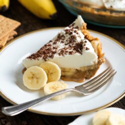 This Banoffee Pie Recipe combines a homemade graham cracker crust, creamy Dulce de Leche, fresh bananas and whipped cream creating one perfect dessert!