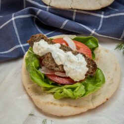 This Beef Gyro recipe with Authentic Greek Tzatziki Sauce is a delicious combination of flavors from red onion, garlic, majoram, rosemary, oregano, salt and pepper that you can easily make at home.