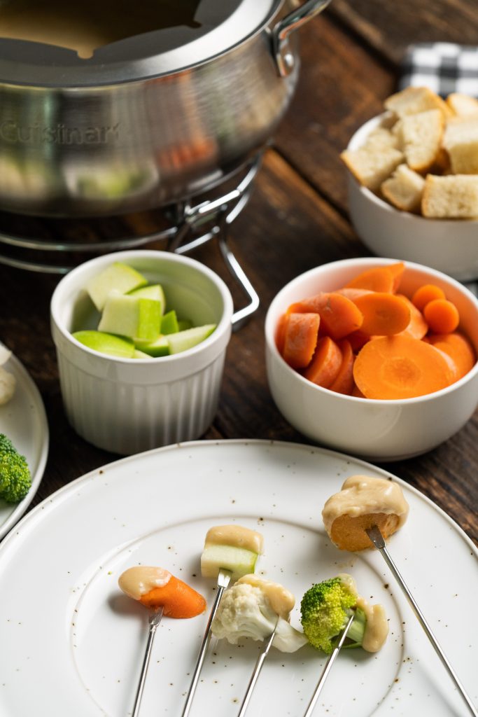 Looking for recipes for cheese fondue? This Beer Cheeses Fondue recipe blends cheddar and Swiss cheeses, light beer, garlic, Worcestershire sauce, mustard powder and freshly cracked black pepper for a delicious appetizer perfect for any party!