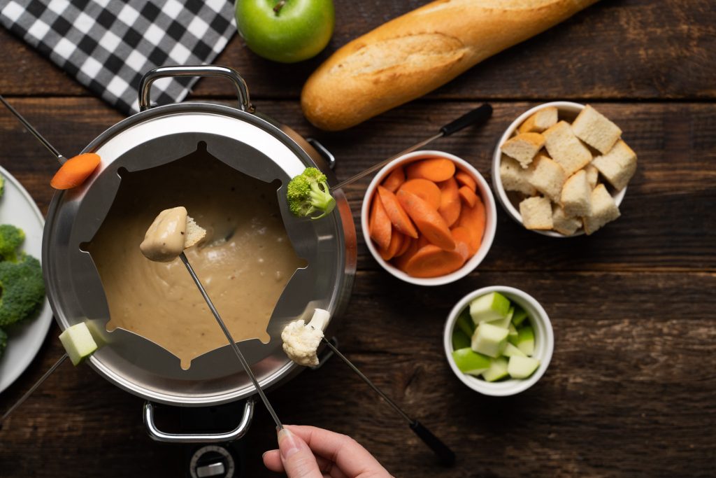This Cheddar Beer Fondue recipe blends cheddar and Swiss cheeses, light beer, garlic, Worcestershire sauce, mustard powder and freshly cracked black pepper for a delicious appetizer perfect for any party!