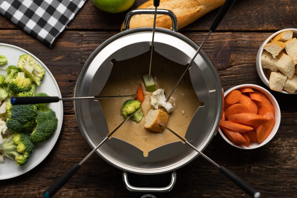 This Beer Cheese Fondue recipe blends cheddar and Swiss cheeses, light beer, garlic, Worcestershire sauce, mustard powder and freshly cracked black pepper for a delicious appetizer perfect for any party!