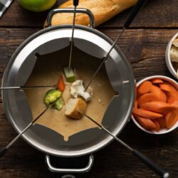 This Beer Cheese Fondue recipe blends cheddar and Swiss cheeses, light beer, garlic, Worcestershire sauce, mustard powder and freshly cracked black pepper for a delicious appetizer perfect for any party!