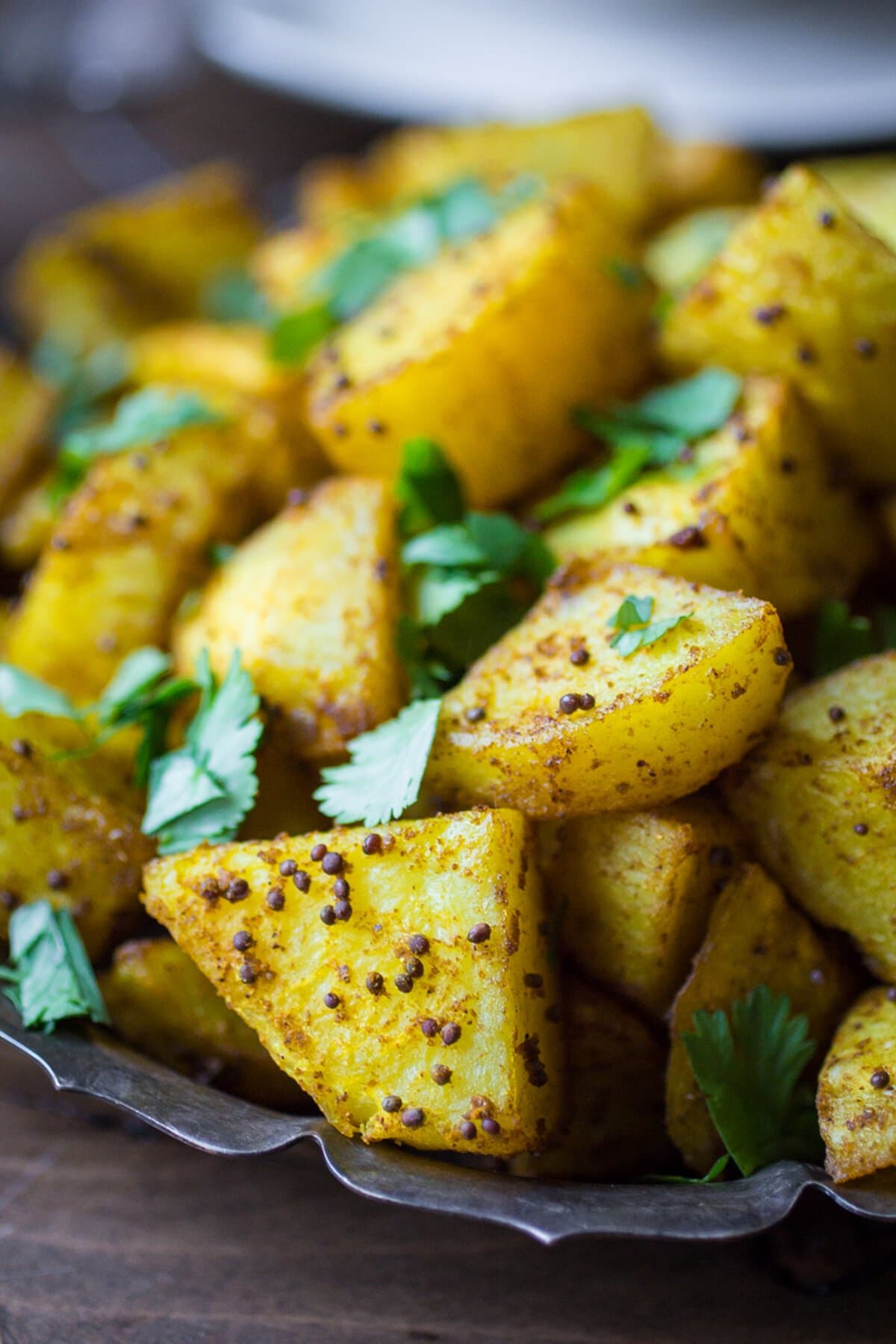 Indian Bombay Potatoes on a silver platter