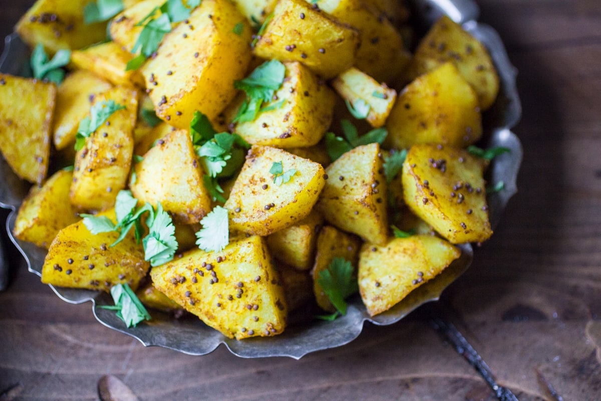Indian Bombay Potatoes on a silver platter