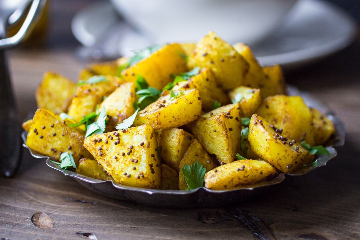 Indian Potatoes recipe on a silver platter