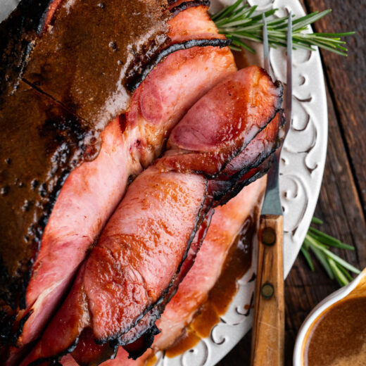 Thick, savory, and coated with a sweet glaze this Brown Sugar Glazed Ham is sure to be a star on your holiday table!