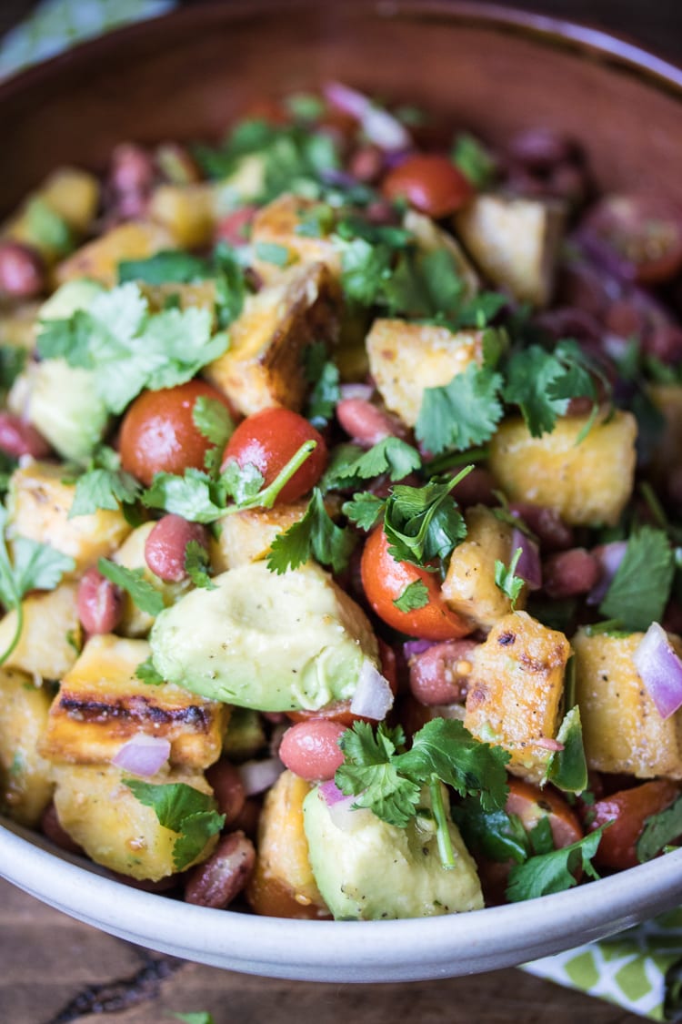 Looking for plantain dishes? Look no further! This Caribbean-style salad of fried plantains, avocado, red beans and tomatoes is perfect for a vacation-worthy meal!