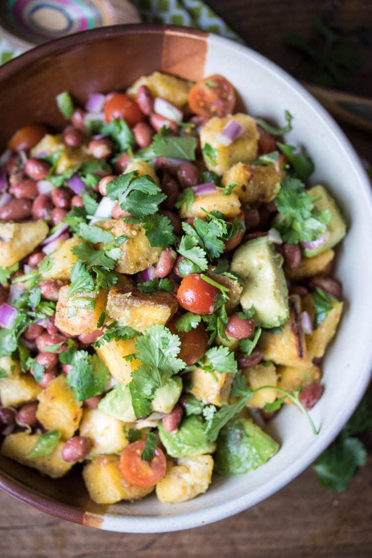 Looking for plantain recipes? Look no further! This Caribbean-style salad of fried plantains, avocado, red beans and tomatoes is perfect for a vacation-worthy meal!