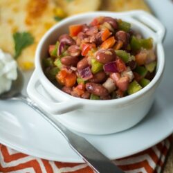 Peppers, onion, and a lime juice-spiked tomato sauce make this Caribbean Red Bean Salad anything but ordinary!