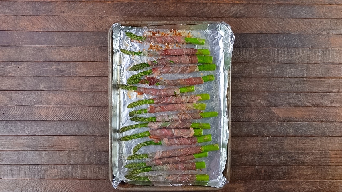 Baked asparagus spears wrapped with prosciutto.
