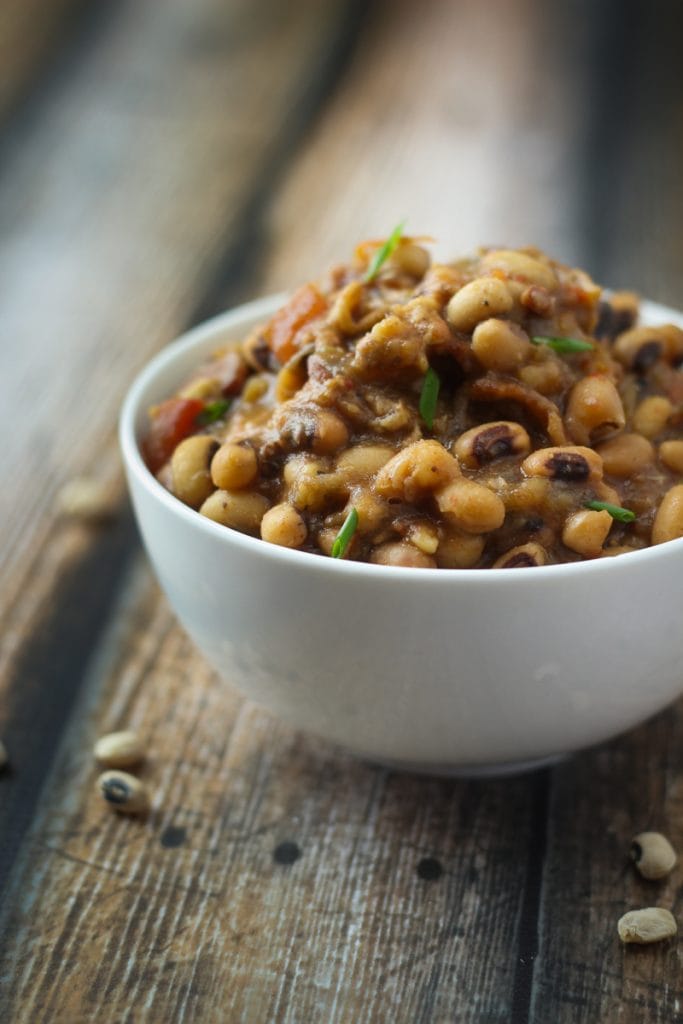 Black eyed peas in crock pot recipe! Just a few minutes of prep, then everything gets tossed in the slow cooker! Black eyed peas are the perfect comfort food (especially for New Year's Day!).