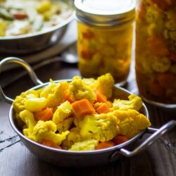 A quick and easy refrigerator pickle recipe featuring curried carrots and cauliflower!