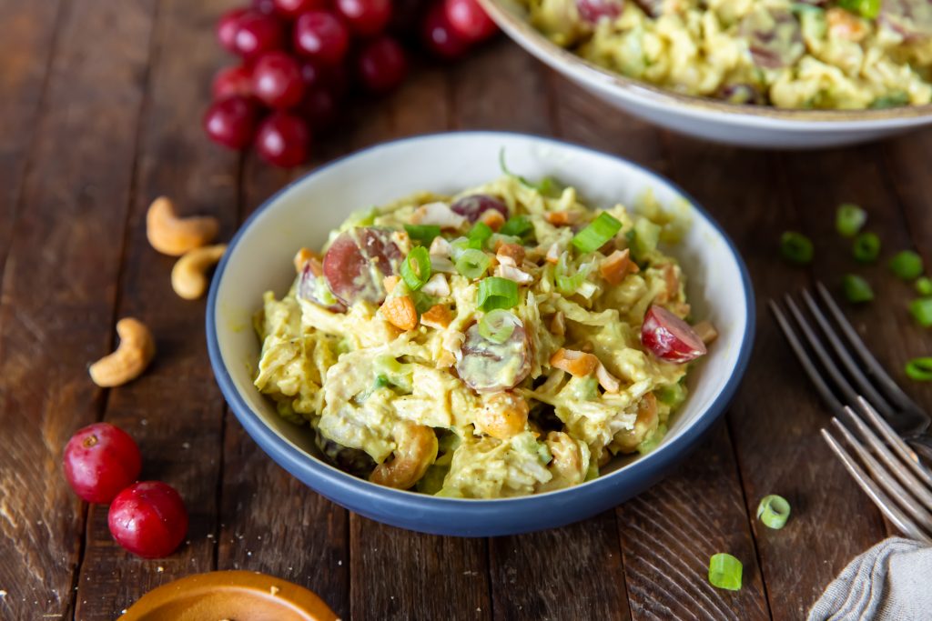 This Curry Chicken Salad recipe is a delicious blend of chicken, savory curry powder, sweet grapes, scallions, celery and cashews for a side dish, snack or a great sandwich.