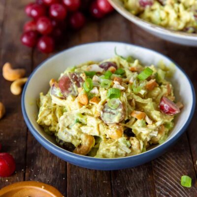 This Curry Chicken Salad recipe is a delicious blend of chicken, savory curry powder, sweet grapes, scallions, celery and cashews for a side dish, snack or a great sandwich.