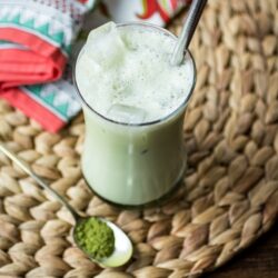 A simple concoction of matcha powder, sugar, milk, and ice makes up this easy Iced Green Tea Latte!