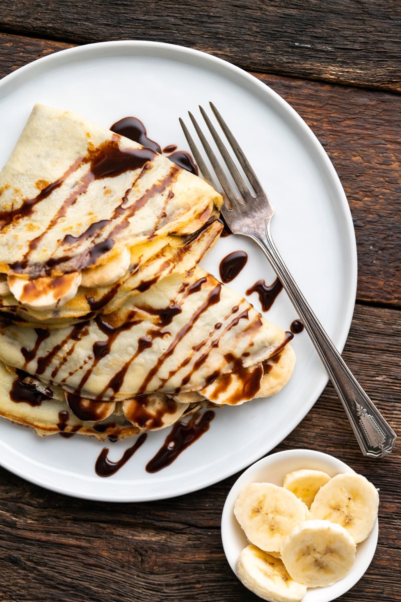 Banana Nutella Crepes on a white plate