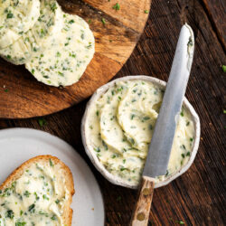 This Garlic Herb Butter can be whipped up in a matter of minutes and is creamy and full of flavor. It can regular butter or turned into a sauce and it tastes delicious on everything!
