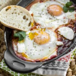 Whether enjoyed first thing in the morning, or as an easy breakfast-for-dinner, this classic dish of eggs simmered in spicy tomato sauce will both delight and satisfy. Be sure to serve your Shakshuka (or, eggs in purgatory) with plenty of crusty bread for dipping!