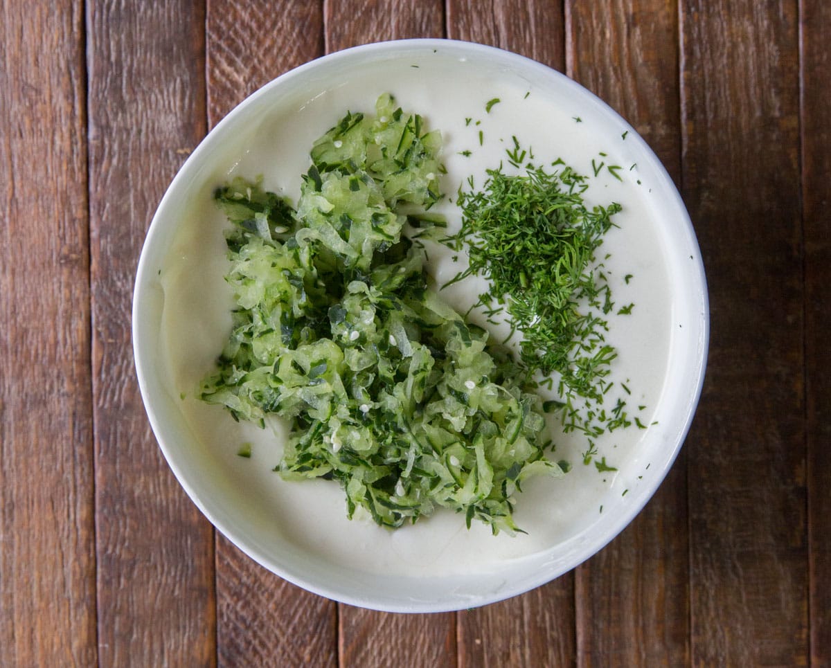 tzatziki yogurt mix with chopped cucumber and minced dill added on top