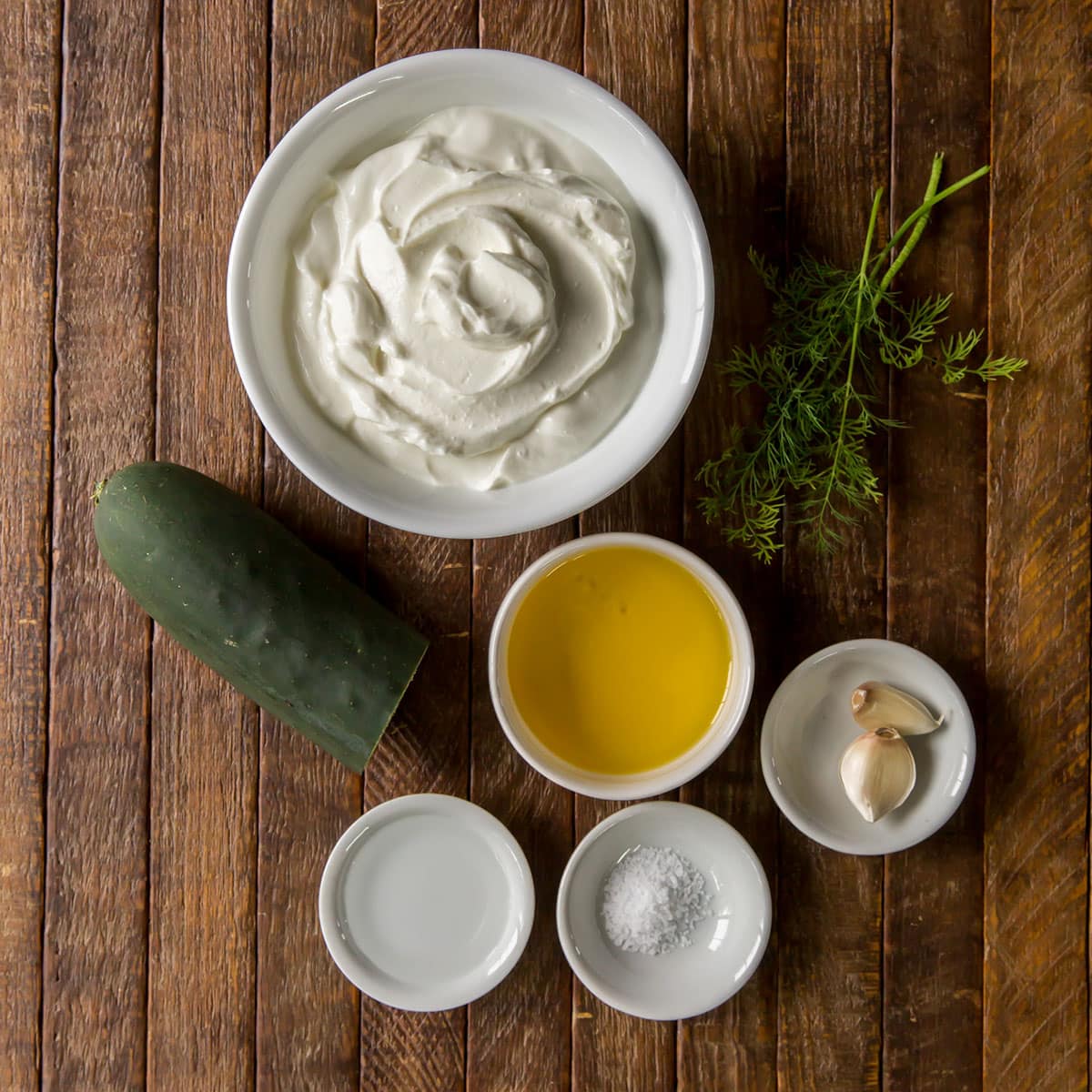 Best Tzatziki Recipe Ingredients in white bowls