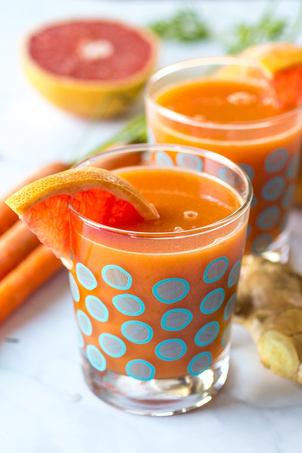 This Immunity Booster Juice recipe blends grapefruit, mango, and carrot for a delicious, healthy drink that is perfect for those days when you feel like you're coming down with something!