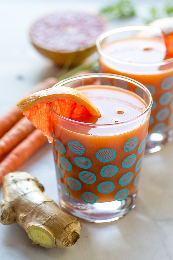 This Immune Booster Juice recipe blends grapefruit, mango, and carrot for a delicious, healthy drink that is perfect for those days when you feel like you're coming down with something!