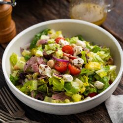Italian Chopped Salad in a white bowl on a table.