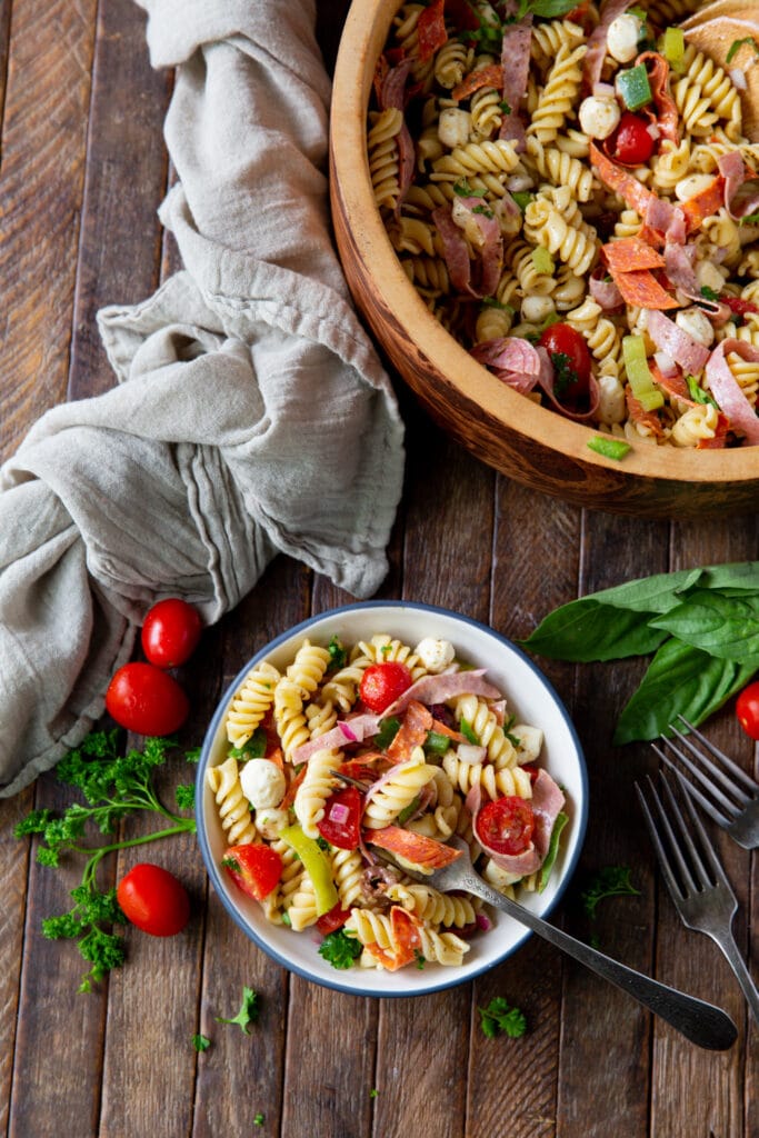 Looking for pasta salad recipes? This Italian Pasta Salad Recipe is a burst of color filled with salami, pepperoncini, Kalamata olives, mozzarella and so much more!
