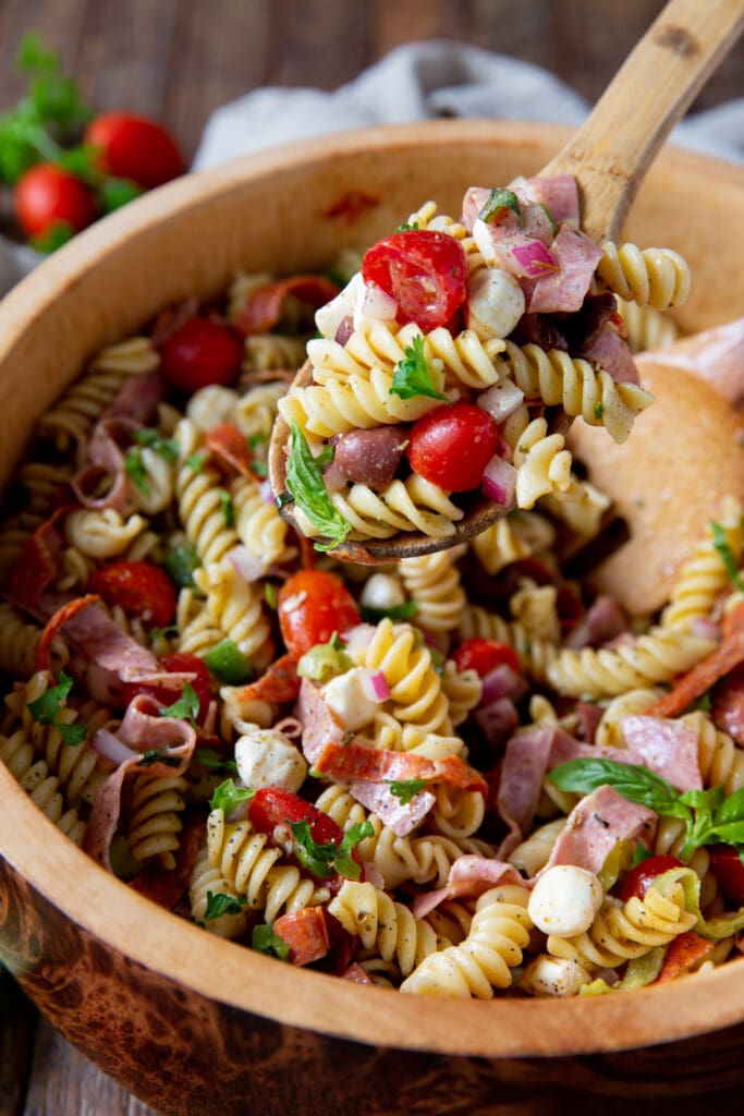 Looking for pasta salad italian dressing? This Italian Pasta Salad Recipe is a burst of color filled with salami, pepperoncini, Kalamata olives, mozzarella and so much more!