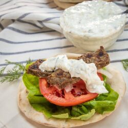 This Homemade Gyro recipe with Authentic Greek Tzatziki Sauce is a delicious combination of flavors from red onion, garlic, marjoram, rosemary, oregano, salt and pepper that you can easily make at home.