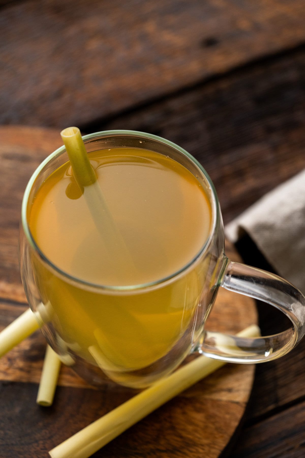 Hot Lemongrass tea in a clear tea cup.