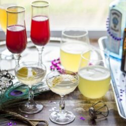 It is easy to host a Mardi Gras Cocktail Party and make these amazing cocktails: a lavender twist on the classic French 75 Cocktail, a Blackberry-Cointreau Bellini, and a Pineapple-Ginger Rum and Champagne Punch.