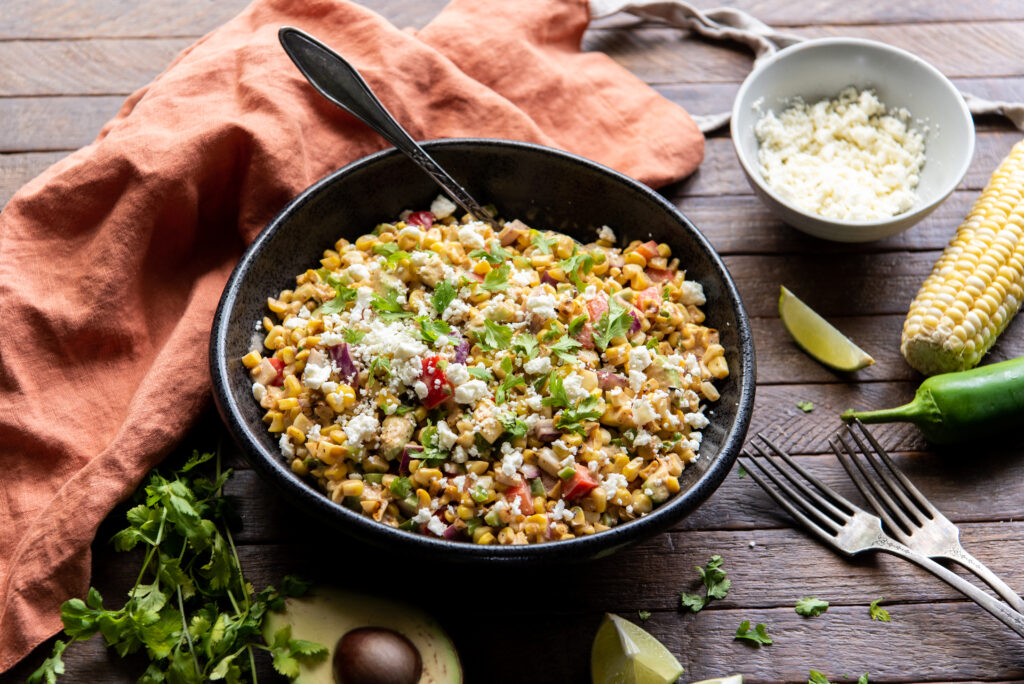 This delicious Mexican corn salad recipe with mayo is the perfect side dish for any Mexican themed meal or as a cool side dish to a summer barbeque.