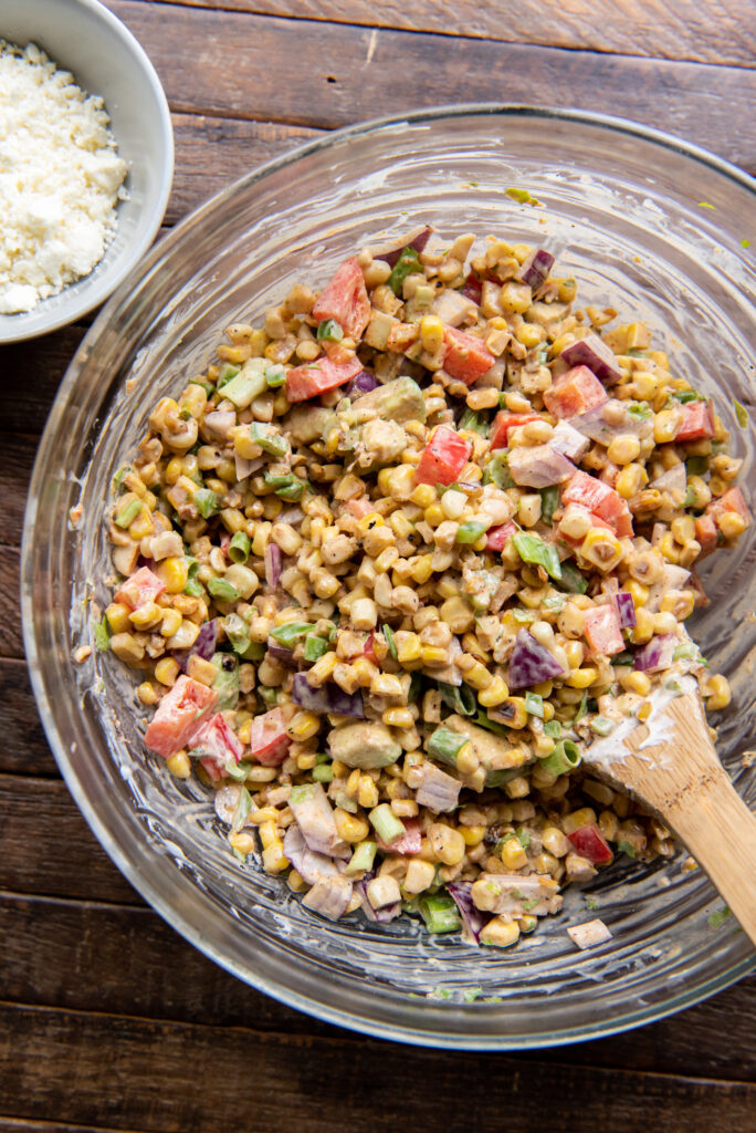 Looking for Mexican corn dishes? This delicious Mexican Corn Salad recipe is the perfect side dish for any Mexican themed meal or as a cool side dish to a summer barbeque.