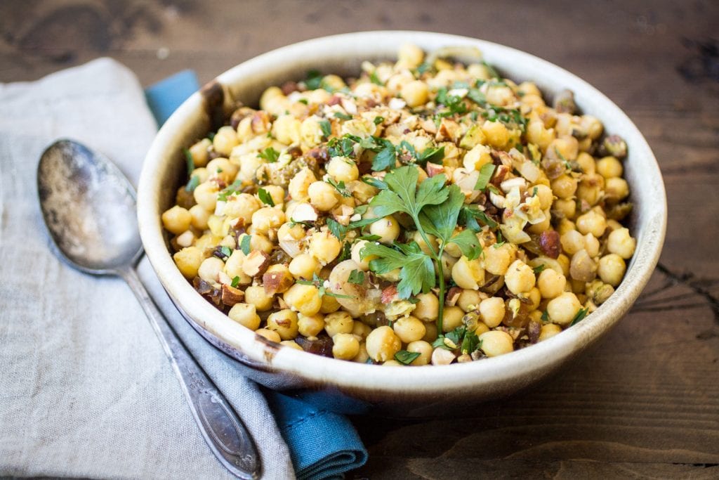 Looking for warm chickpea recipes? This is a great one! Dried dates and crunchy pistachios make this Moroccan Chickpea Salad recipe both sweet and savory!