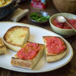 Pan con Tomate (bread with tomato) just might be the easiest-- yet tastiest!-- appetizer you'll ever make. Pair with a few Spanish tapas to create a filling and delectable meal!