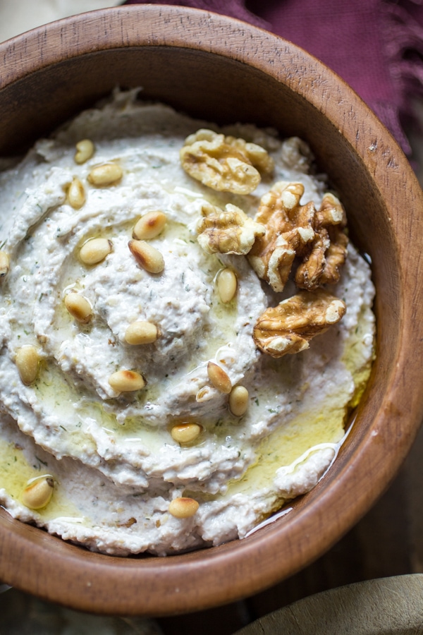 This thick and creamy Turkish Nut and Yogurt Dip recipe is chock full of ground nuts and bold flavor. Perfect with toasted pita chips, spread onto sandwiches, or as part of a gourmet veggie platter!