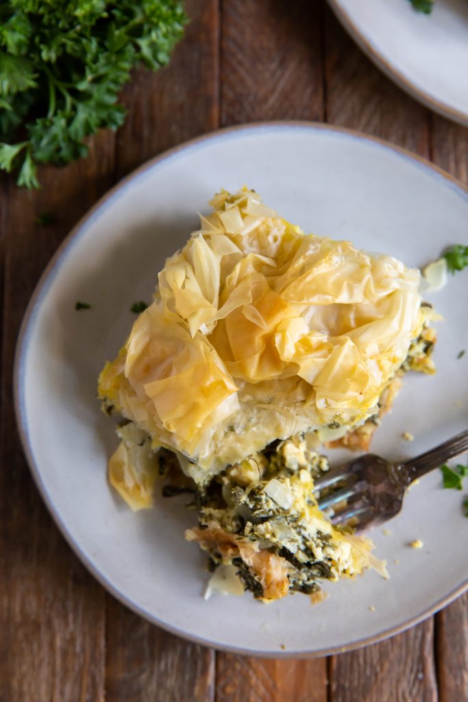 Wanting authentic spanakopita? This Spanakopita recipe is a combination of the traditional Greek flavors of Spinach and Feta to make a delicious Greek Spinach Pie!