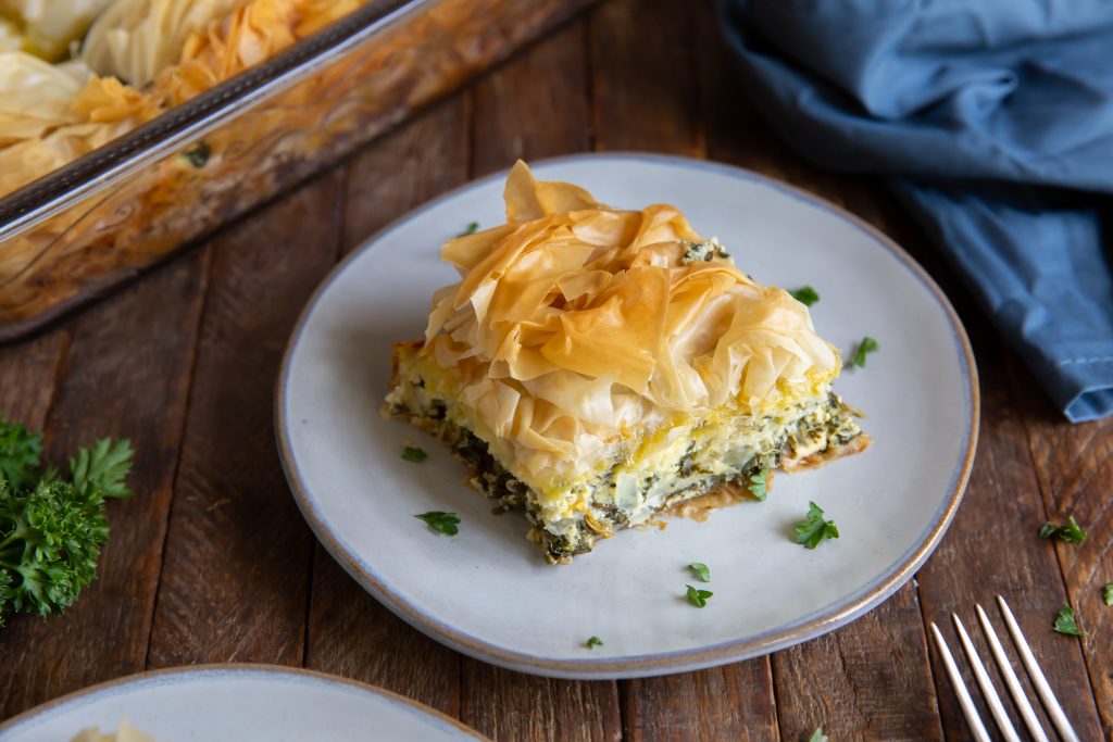 Wanting an authentic spanakopita recipe? This Spanakopita recipe is a combination of the traditional Greek flavors of Spinach and Feta to make a delicious Greek Spinach Pie!