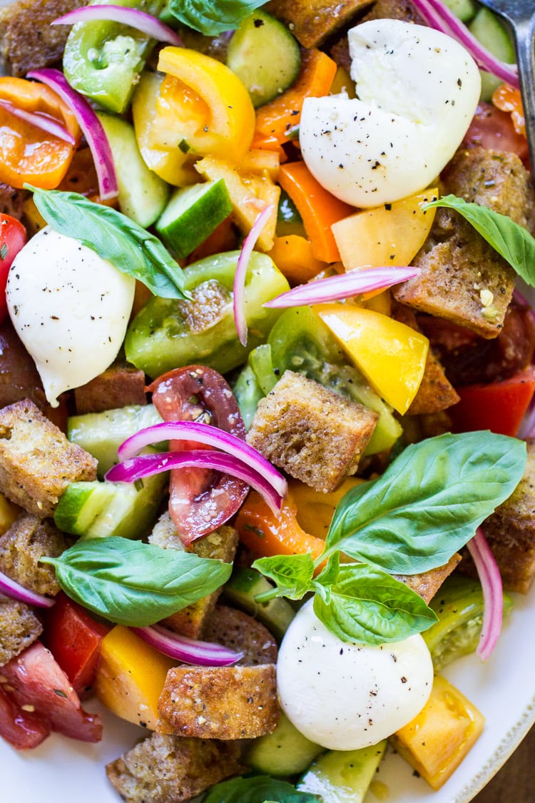 This easy Panzanella Salad recipe is a delicious mix of veggies and bread so you can enjoy the flavors of summer any time of year with this classic Italian salad!