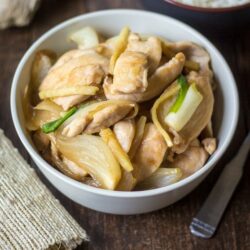 Thai Chicken with Ginger: Savory chicken, sharp onions, and bright ginger are coated in a wonderfully versatile stir-fry sauce in this take-out favorite.