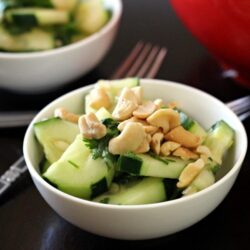 This Thai cucumber salad recipe mixes cucumbers, cashews, with a brown sugar, chili-garlic sauce, cilantro and lime juice for a delicious salad to add to your next Thai dinner.