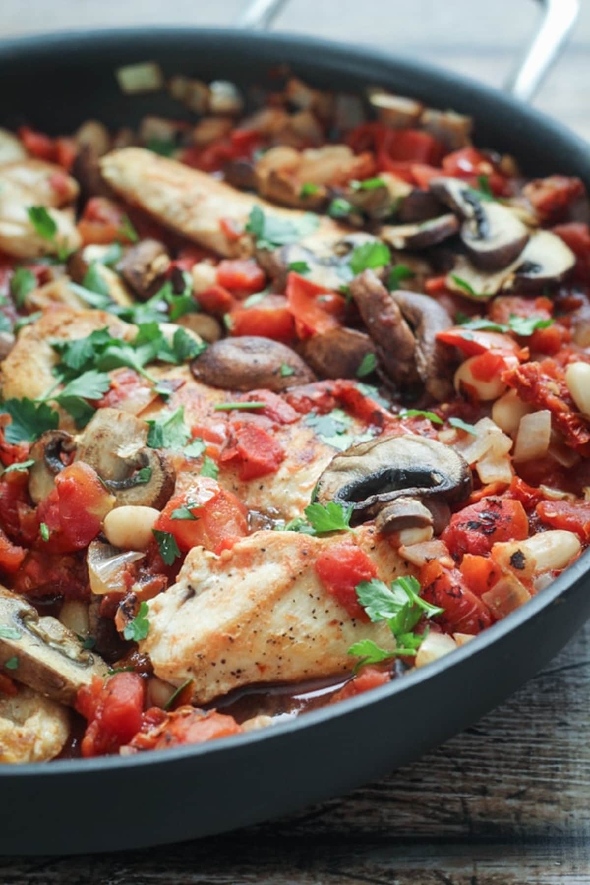 Tuscan chicken in a skillet.