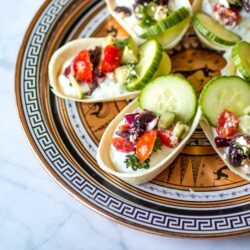 These Tzatziki Bites are finger food at its finest. Topped with chunky Greek-style salsa, these two-bite treats are full of fresh flavor!