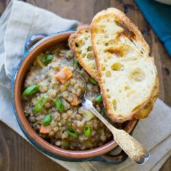 Vegan Bavarian Lentil Soup is the ultimate comfort food for cold weather and rainy days. Scoop it up with buttered crusty bread for a hearty meal!